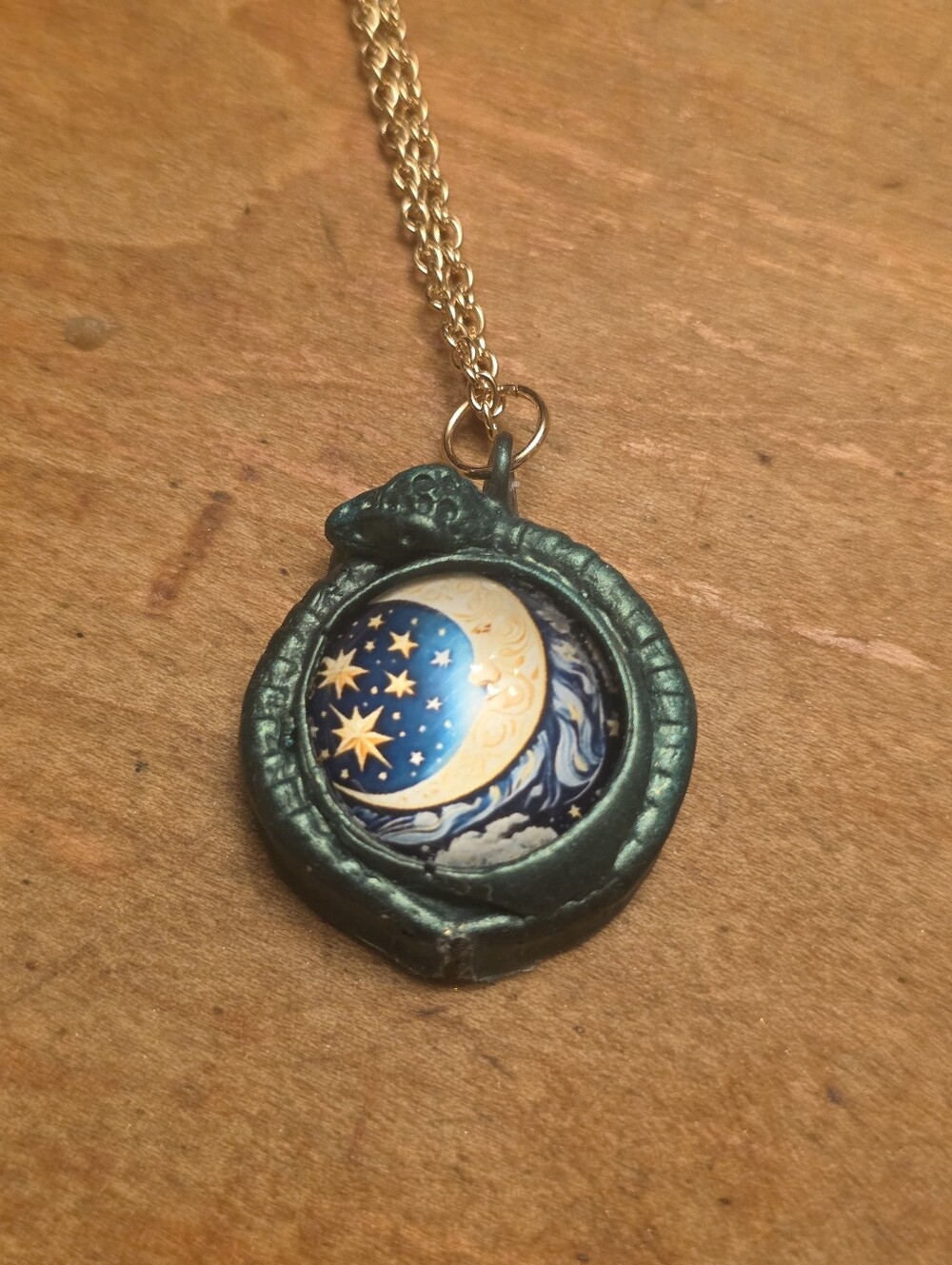 Green Snake Wrapping A Celestial Cabochon Of Moon & Stars On A Gold Tone Chain